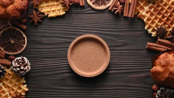 Male hands holding coffee cup, cookies and spices on wooden rustic background - Footage, Video