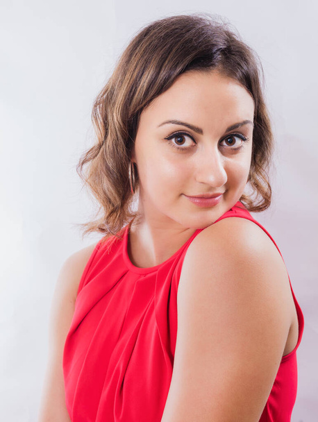 Beautiful young coquette woman in red dress - Foto, afbeelding