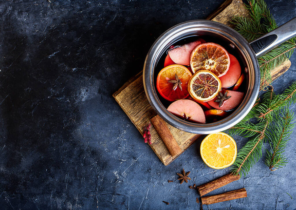Delicious mulled wine and ingredients on grey table, flat lay. Space for text. Christmas content - Photo, Image