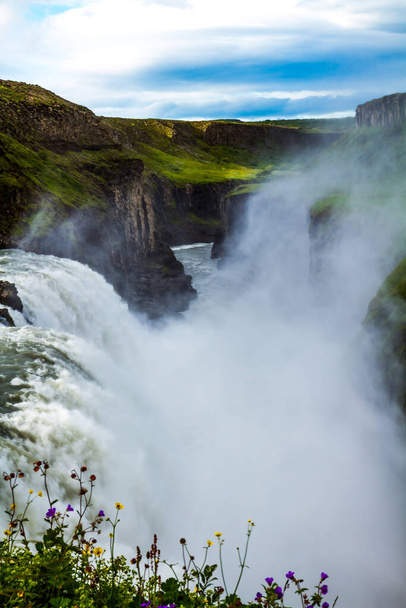 Southwest Iceland. Water smoke hanging over the waterfall all the time. Gullfoss "Golden Falls" is Iceland's most beautiful waterfall on the Hvita River. The concept of extreme and photo tourism - Valokuva, kuva