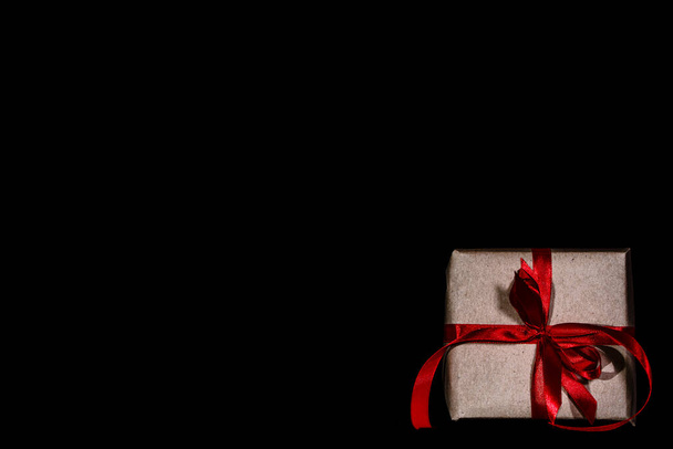 Christmas present or black friday sale with gift box and ribbon - Foto, afbeelding