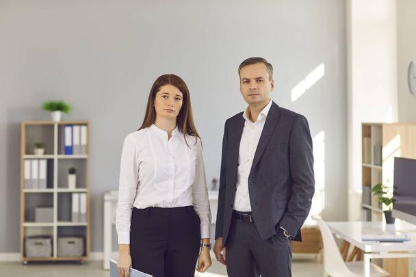 Portrait of confident business people standing in the office and looking at camera - Photo, image