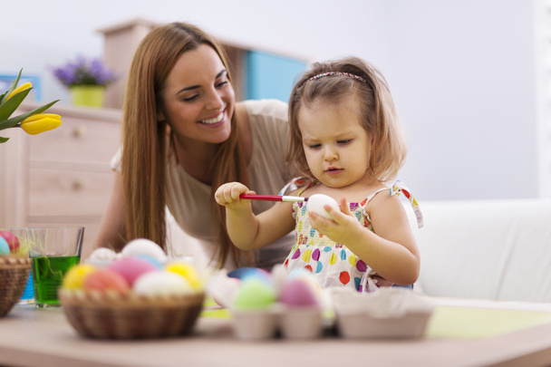 Family  painting easter eggs - Foto, immagini