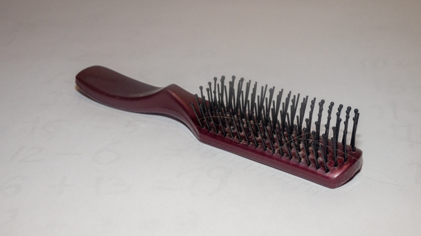 Womens hair loss problem or Womens hair fall on a different comb on white background - Photo, Image