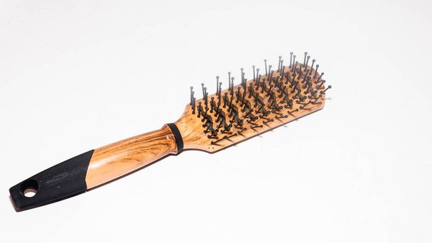 Womens hair loss problem or Womens hair fall on a different comb on white background - Photo, Image