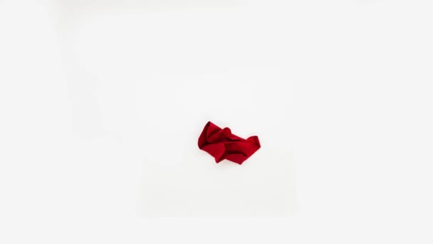 Red paper heart uncrumples and crumples, stop motion animation. - Footage, Video