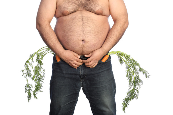 Grasso uomo in possesso di carota
 - Foto, immagini