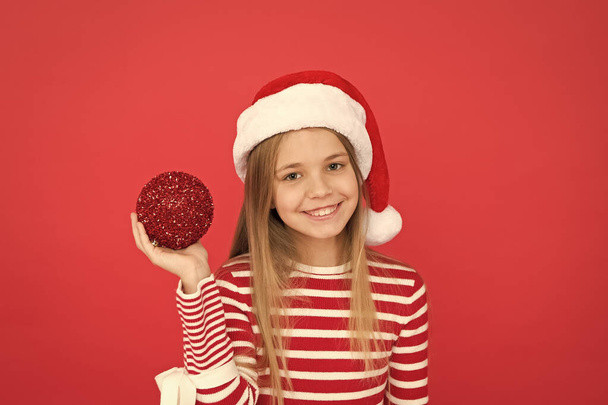 Shine and glitter. Child Santa Claus costume hat. Happy smiling face. Beautiful detail. Positivity concept. Cheerful mood. Christmas party. Winter holidays. Playful mood. Christmas celebration ideas - Foto, afbeelding