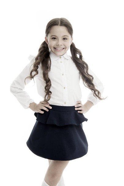 September time to study. Girl cute pupil on white background. Pupil of first grade. School uniform. Back to school. Student little kid adores school. Smiling schoolgirl. Celebrate knowledge day - Foto, Imagen