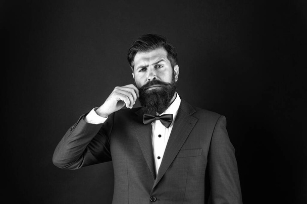 Masculine aesthetic. Male fashion and aesthetic. Businessman formal outfit. Classic style aesthetic. Looking good does not have to take too much effort. Well groomed man with beard in suit jacket - Photo, image