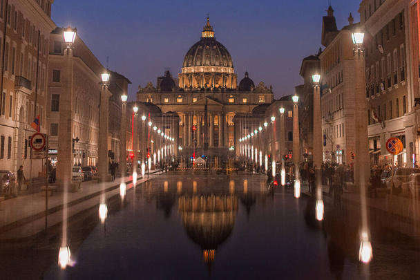 this is the vatican building just after sunset. the reflection was made using my mobile phone - Photo, Image