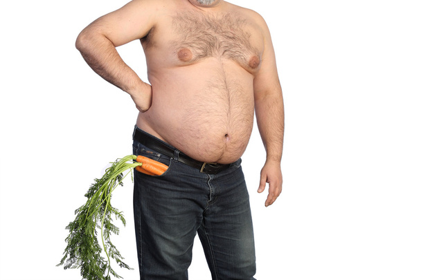 dikke man bedrijf wortel - Foto, afbeelding