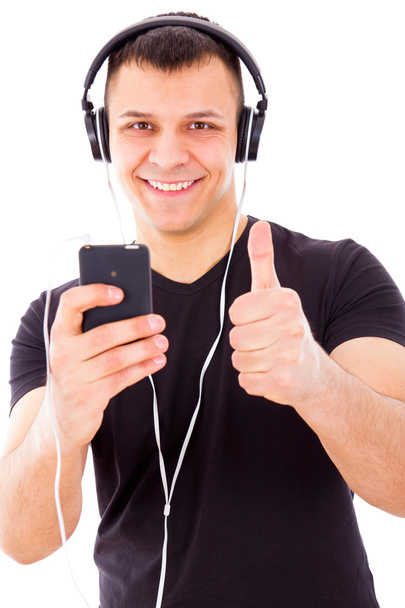 man with headphones listening music on mp3 player - Foto, afbeelding