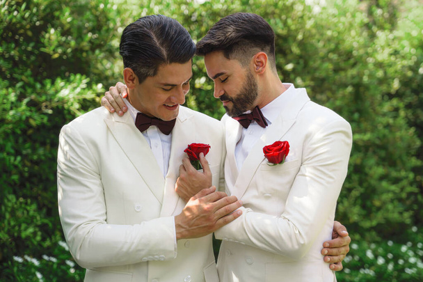 caucasian lgbtq gay marriage couple having romantic moment together after wedding ceremony. Concept of LGBTQ same sex relation - Фото, зображення
