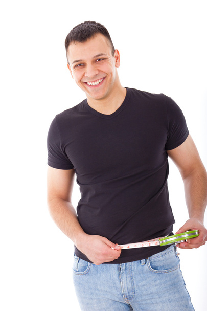smiling handsome man with measuring tape - Photo, Image