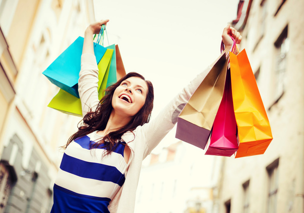 Woman with shopping bags in city - Φωτογραφία, εικόνα