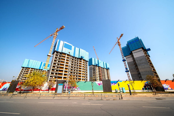 Lots of tower Construction site with cranes and building with blue sky background - Photo, Image