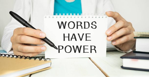 Words have Power - Businesswoman holding blackboard with text - Fotó, kép