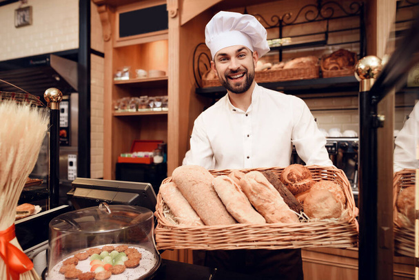Young Bearded Man in Apron Standing in Bakery. - Foto, Imagen