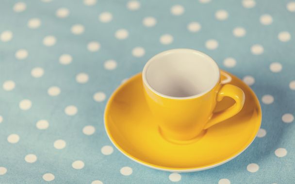Cup of a coffe on polka dot cover.  - Photo, Image