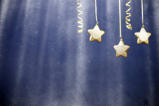 Holiday background with golden christmas decorations and magic holiday light. - Valokuva, kuva