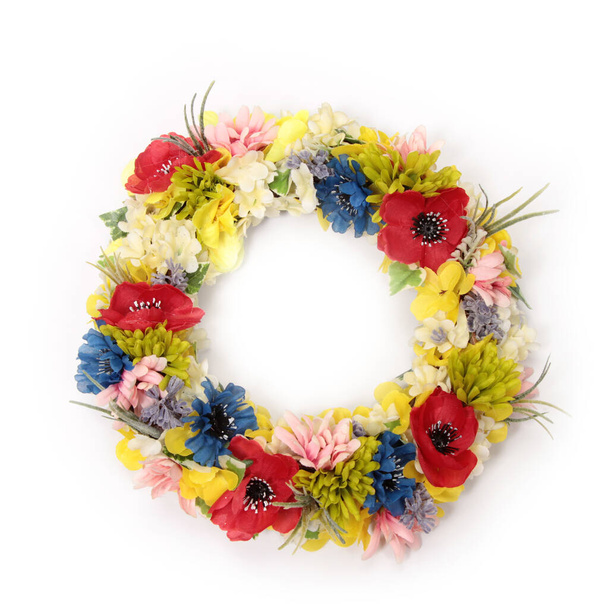 A closeup shot of colorful decorative artificial flowers on white background - Foto, Imagem