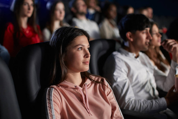 Young girl enjoying free time in movie theater. - Photo, Image