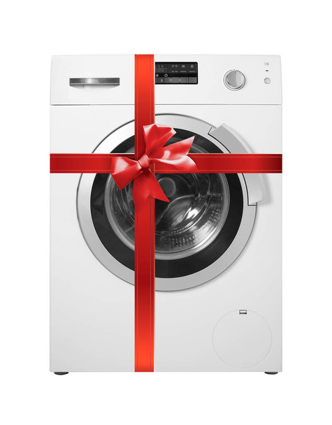 Major készülék - Előnézet mosógép ajándék kötött piros íj elszigetelt fehér alapon - Fotó, kép