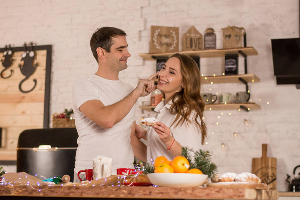 young loving couple in kitchen at the home - Foto, Imagen