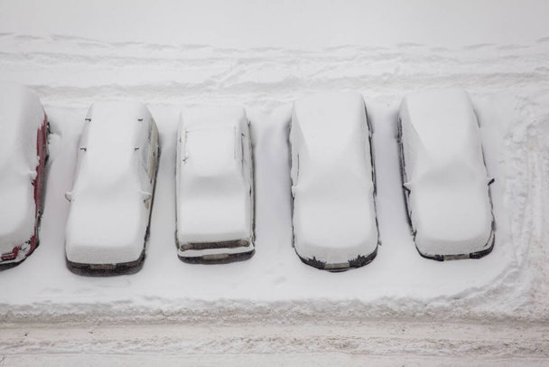 winter landscape with snow-covered cars - Fotó, kép