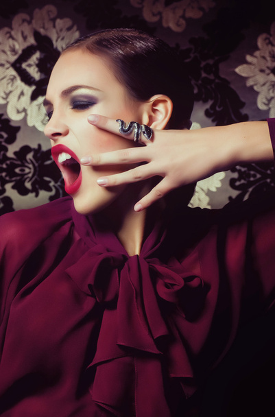 Screaming woman with snake ring - Foto, Imagen