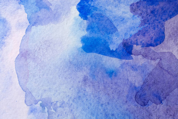 Abstract Hand painted blue purple watercolor background on wet paper, texture for creative wallpaper or design artwork. - Фото, изображение