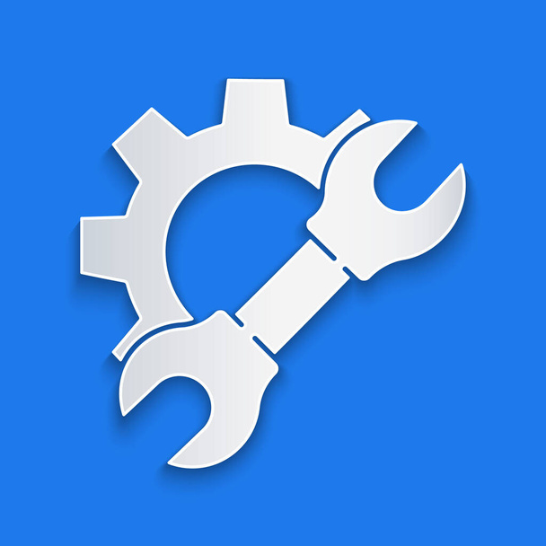 Paper cut Wrench spanner and gear icon isolated on blue background. Adjusting, service, setting, maintenance, repair, fixing. Paper art style. Vector Illustration. - Vector, Image