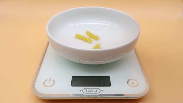 Pasta being weighed on digital kitchen scales - Footage, Video