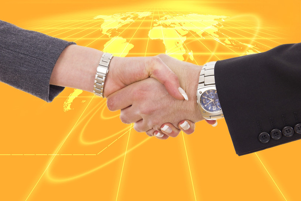 business shaking hands in front of earth map - Photo, Image