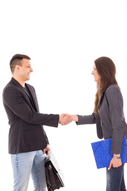 Бизнесмен и деловая женщина пожимают друг другу руки - Фото, изображение