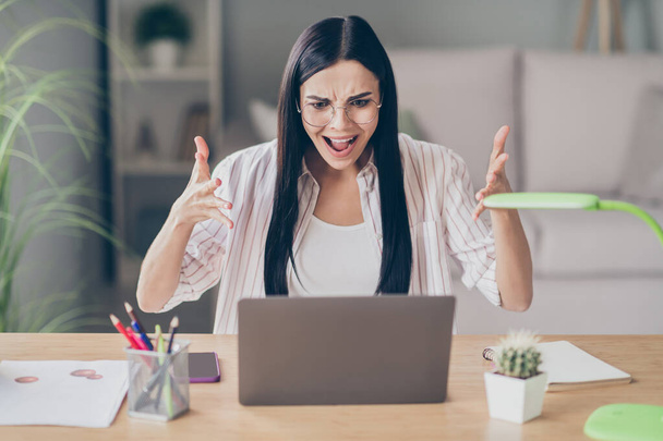 Photo portrait of frustrating woman screaming waving two hands at laptop in home office - Fotó, kép