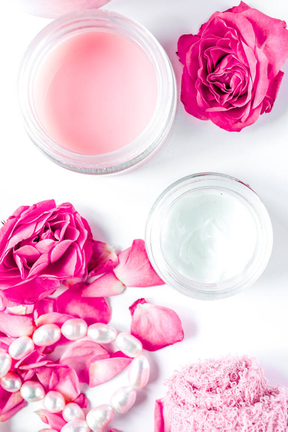 rose salt and cream for nail care in spa on white background top view - Fotó, kép