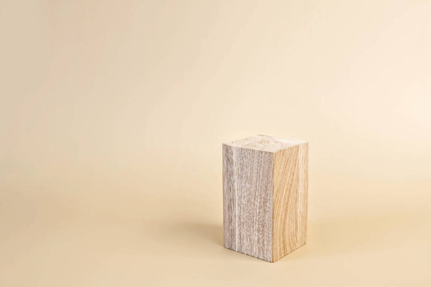 Natural wooden stand for presentation and exhibitions on pastel background. Abstract empty podium for organic cosmetic products. Minimal style. - Photo, Image