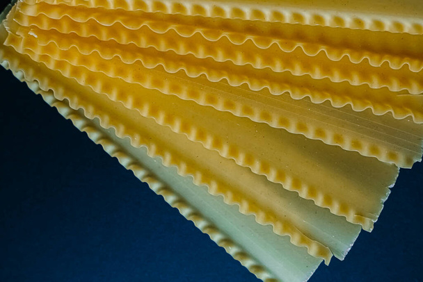 italian pasta tagliatelle on dark blue background - Foto, Bild
