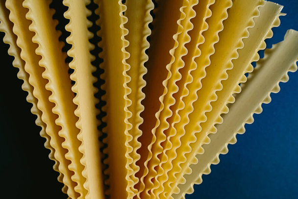 italian pasta tagliatelle on dark blue background - Fotoğraf, Görsel