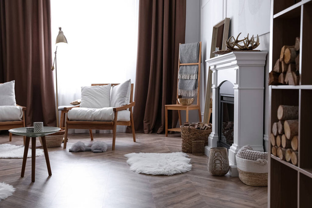 Beautiful living room interior with fireplace and armchairs - Valokuva, kuva