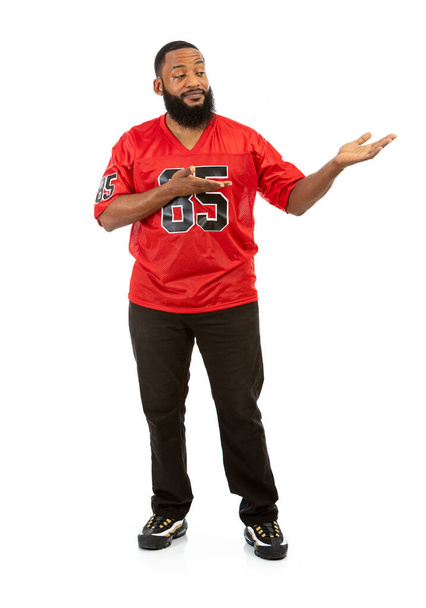 An African American man in a football team jersey in various poses. - Φωτογραφία, εικόνα