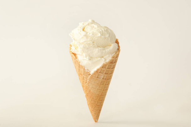 Delicious ice cream in waffle cone on white background - Fotó, kép