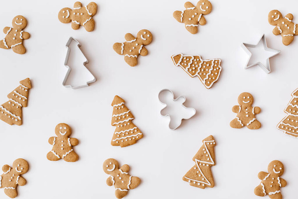 Homemade gingerbread cookies on white background. Christmas, winter, new year composition. Flat lay, top view - Foto, Bild