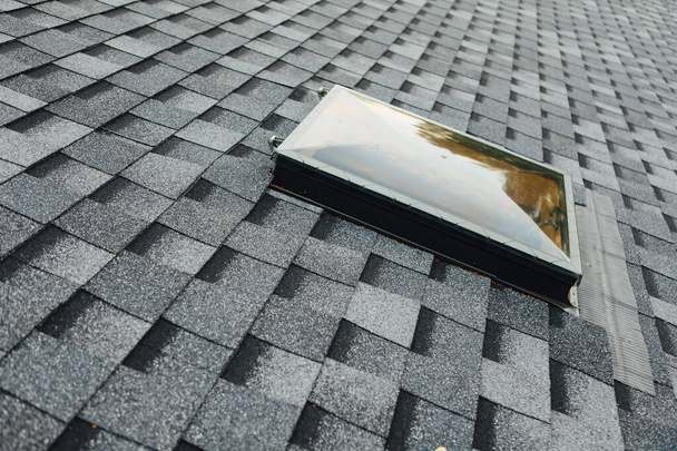 exit roof window on shingles flat polymeric roof-tiles - Photo, Image