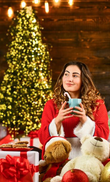 Happy new year. Woman enjoy cozy atmosphere. Decorate home. Xmas spirit. Happy girl at christmas tree. Family holiday celebration. Winter sale. Celebrate holiday. Holiday tradition. Santa is near - Photo, Image