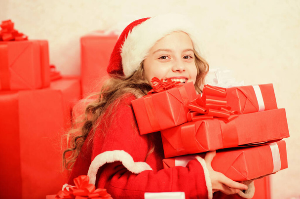 Dreams come true. Winter happiness concept. Explore christmas gifts. Unpacking christmas gift. Kid excited about christmas present. Winter miracle. Girl celebrate christmas. Santa bring her gift - 写真・画像