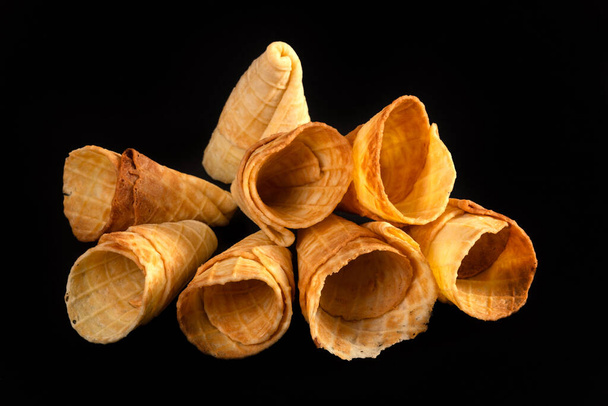 Collection of homemade empty ice cream cones isolated on black background. - Foto, Imagem