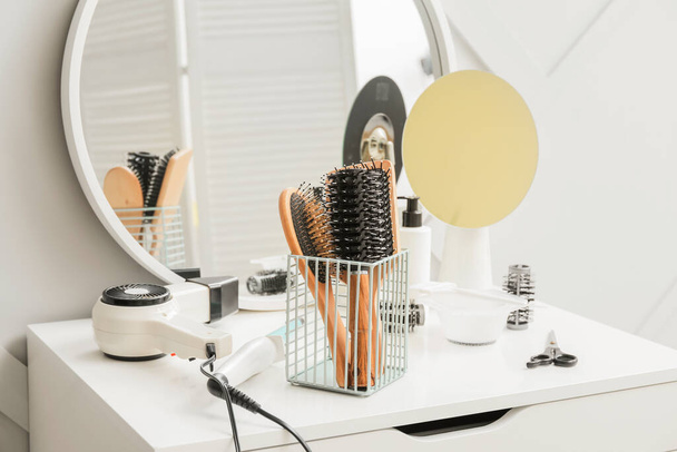 Professional hairdresser brushes in salon - Photo, Image